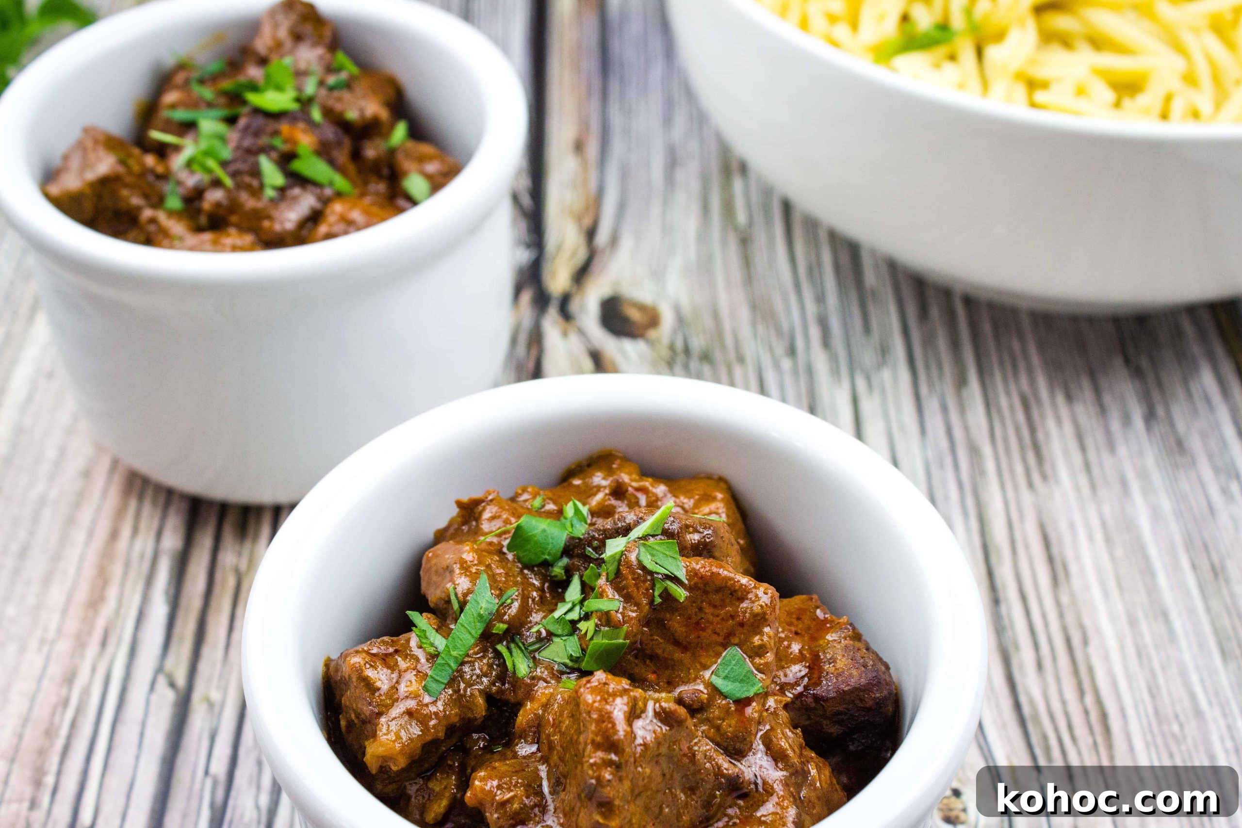 23 Dump-and-Go Slow Cooker Recipes That Taste Homemade 19 Hungarian Goulash in two white bowls.