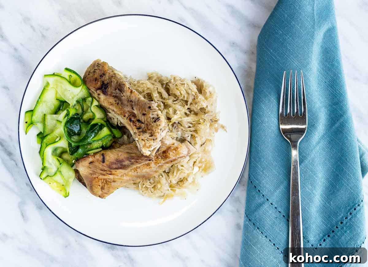23 Dump-and-Go Slow Cooker Recipes That Taste Homemade 20 Ribs and Sauerkraut with a fork.