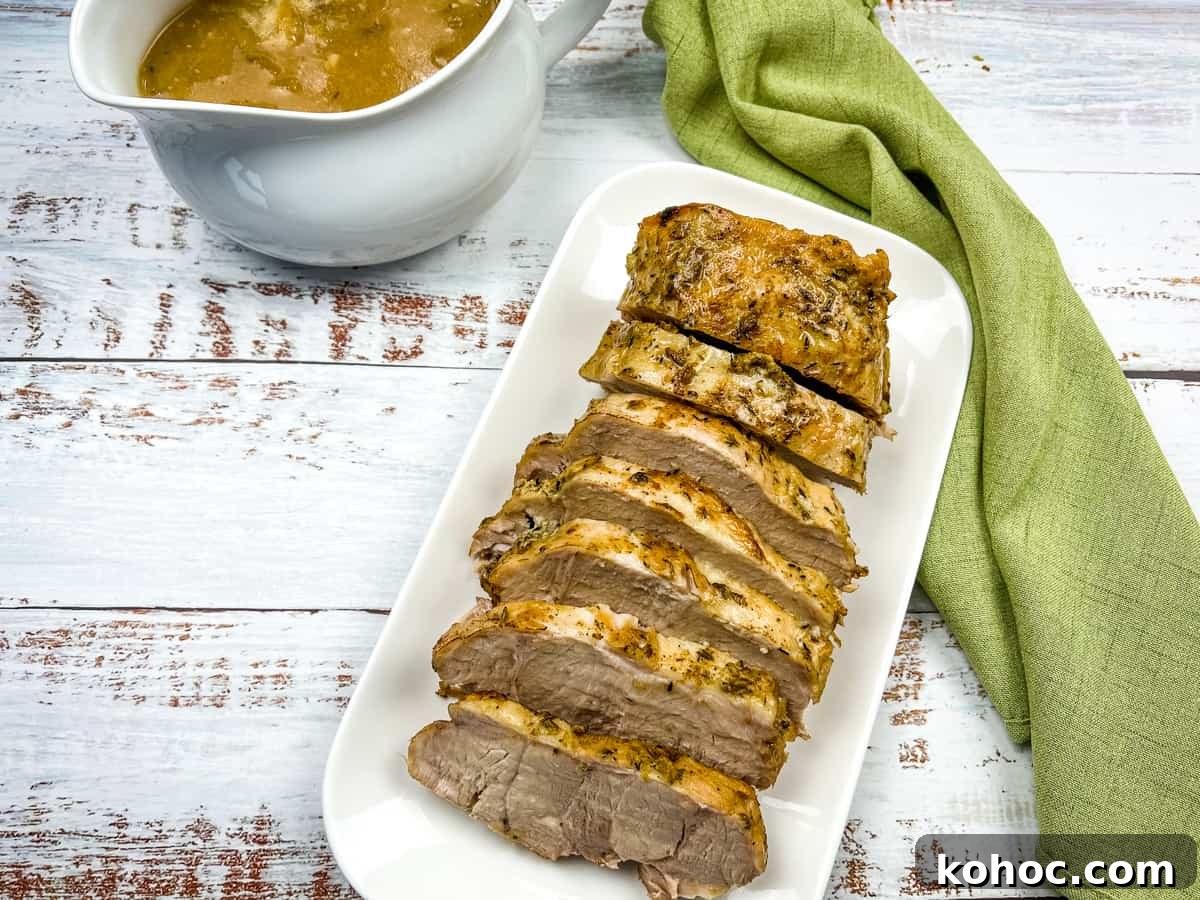 23 Dump-and-Go Slow Cooker Recipes That Taste Homemade 22 German Pork Loin on a platter with a gravy boat nearby.