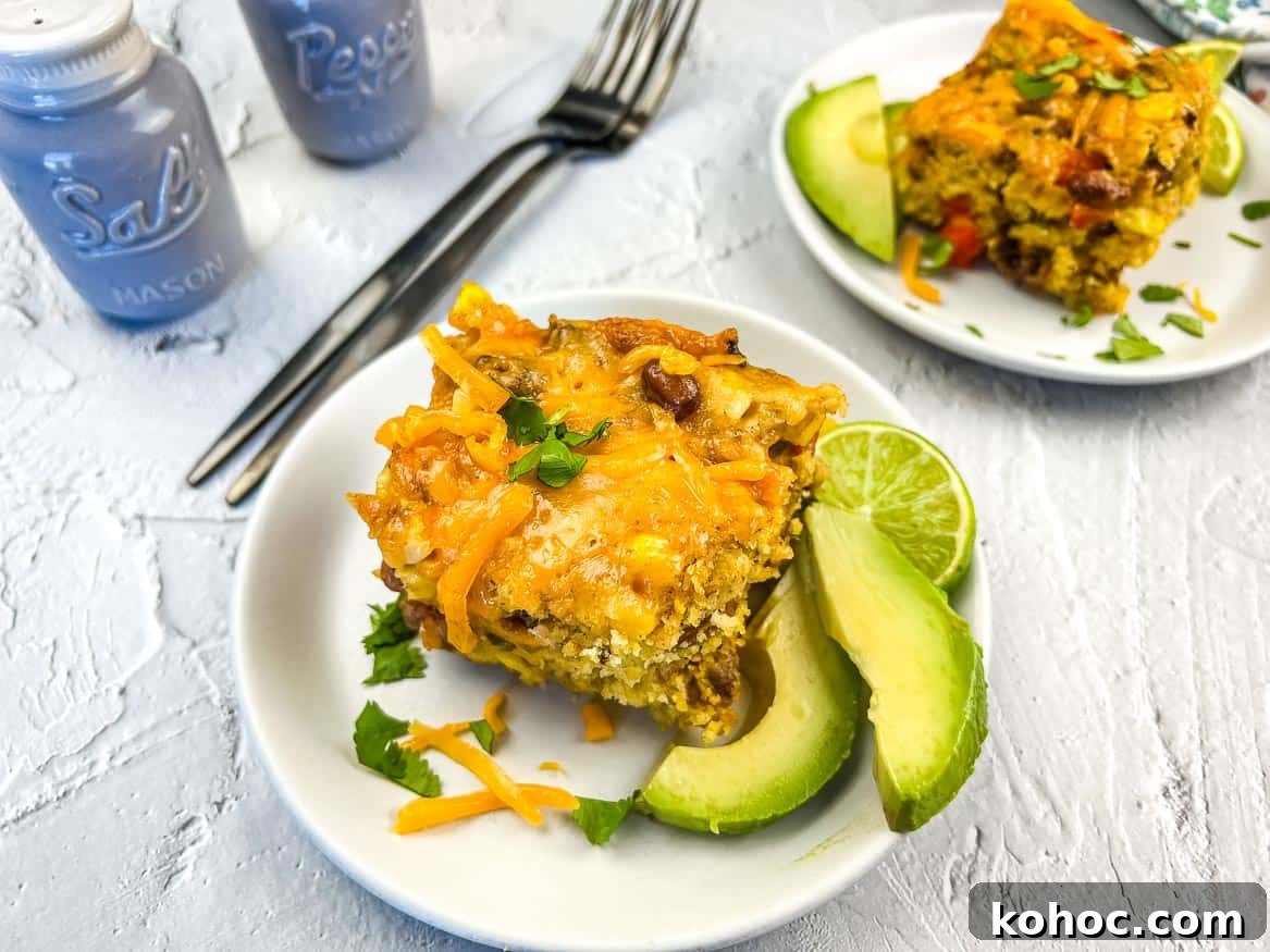 23 Dump-and-Go Slow Cooker Recipes That Taste Homemade 24 Two servings of Cowboy Cornbread Casserole on plates.
