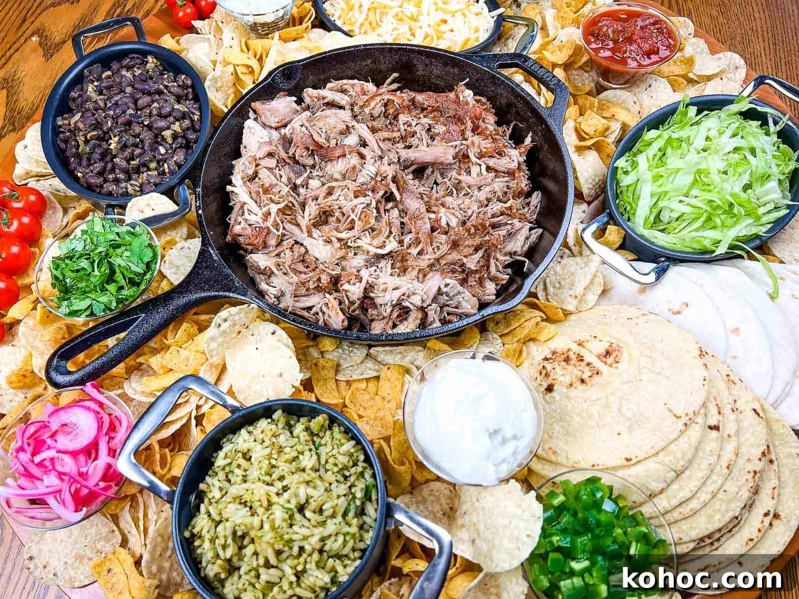 23 Dump-and-Go Slow Cooker Recipes That Taste Homemade 25 A platter of pork carnitas board on a wooden table.
