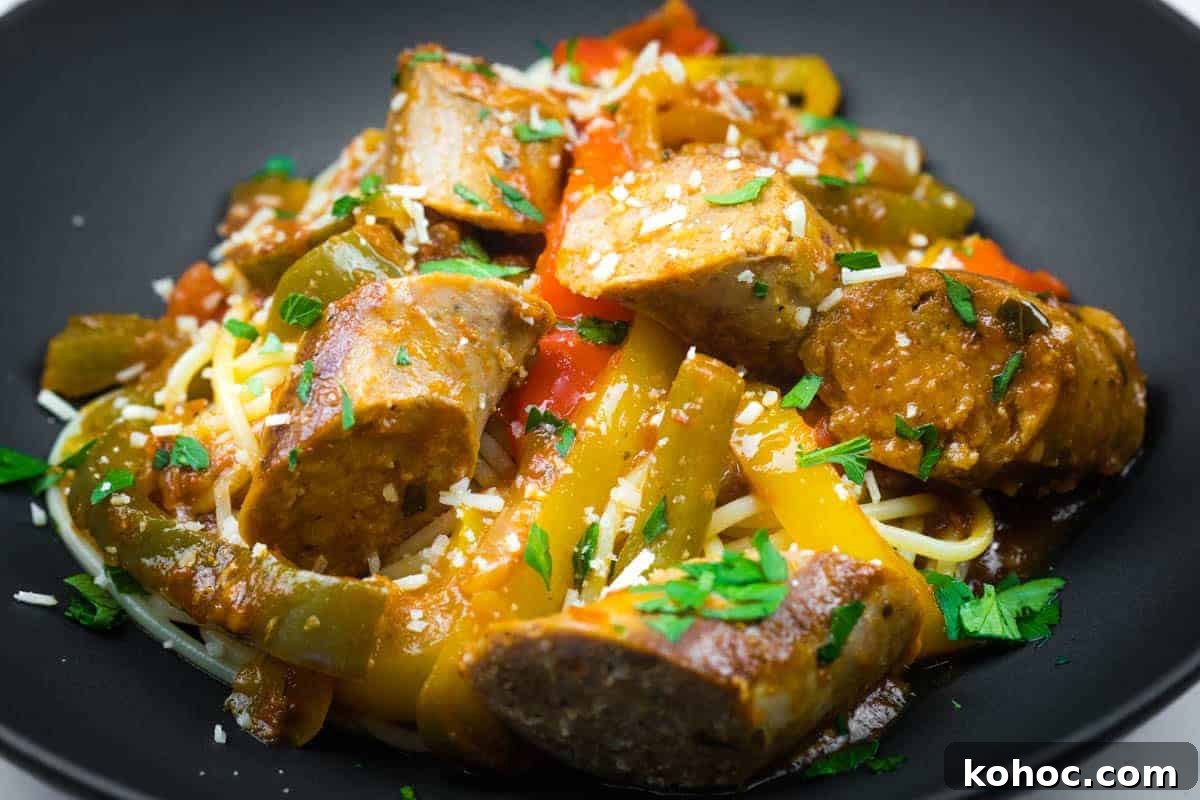 23 Dump-and-Go Slow Cooker Recipes That Taste Homemade 9 Slow cooker sausage and peppers garnished with grated cheese and chopped parsley.