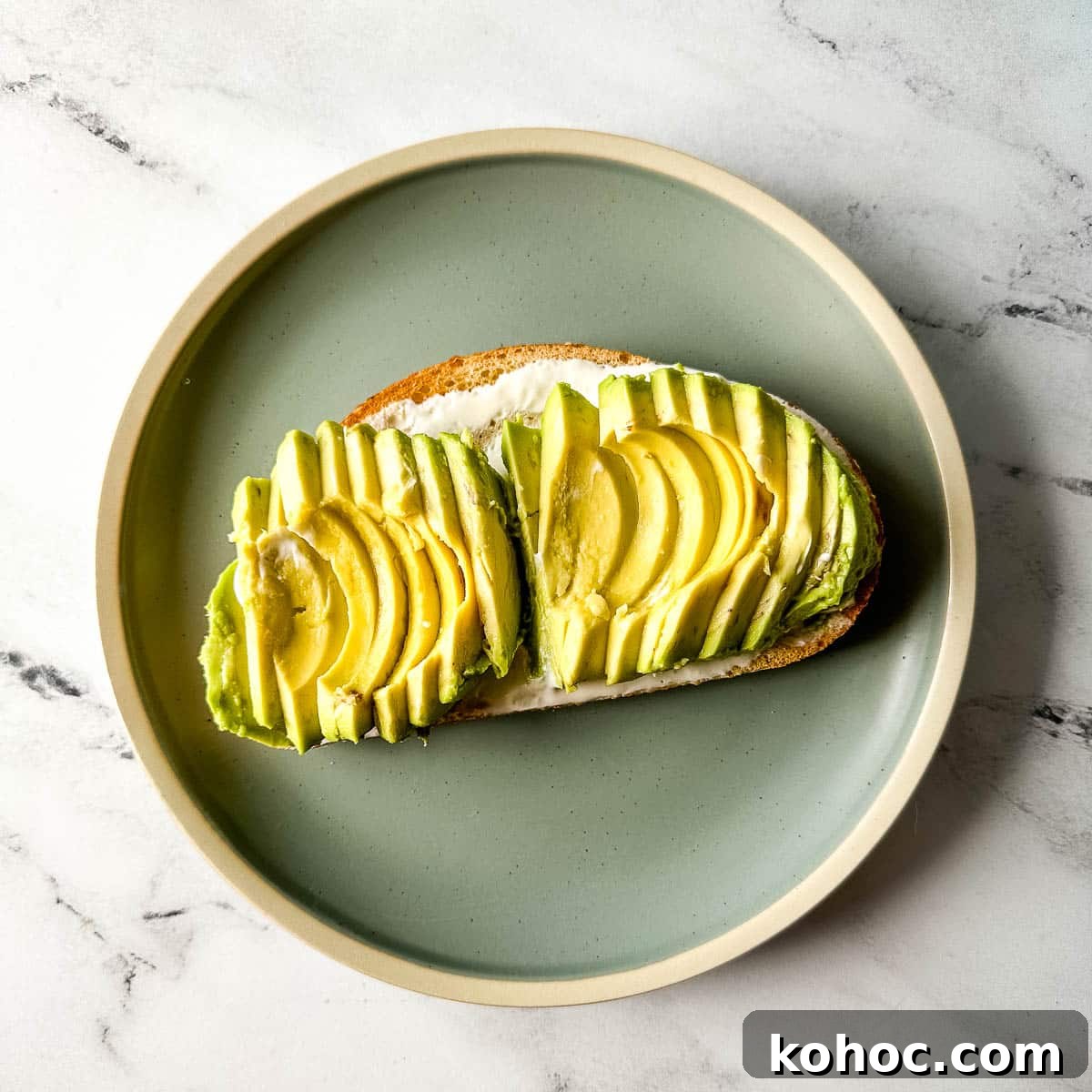 Creamy Avocado Lime Tartine Recipe for Fresh Breakfast 9 thinly sliced avocado is added to the toast with cream cheese.
