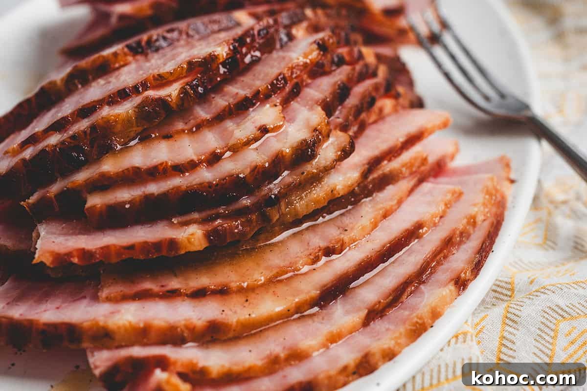 Sweet Pineapple Glaze for Ham: Tangy Ham Glaze Recipe 7 Sliced ham topped with pineapple glaze.