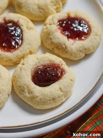 The sourdough thumbprints are on a white plate surrounded by a red plaid bow.