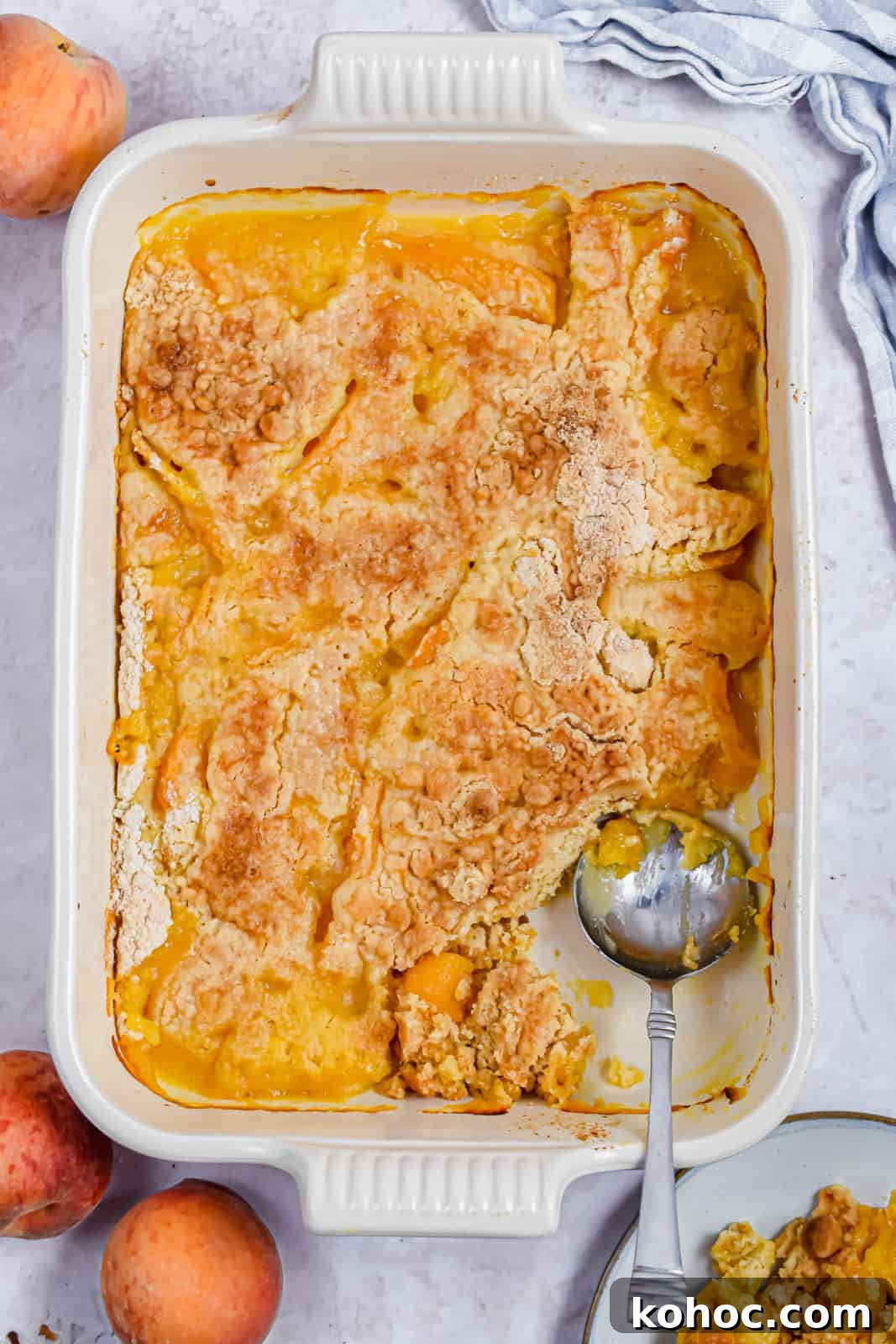 A pan of the finished dessert has a spoon in the corner.