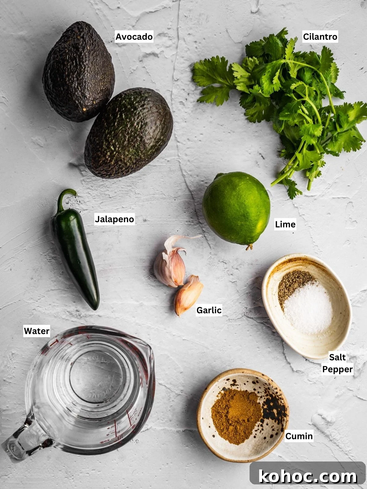 salsa de aguacate recipe ingredients with individual labels on a board.