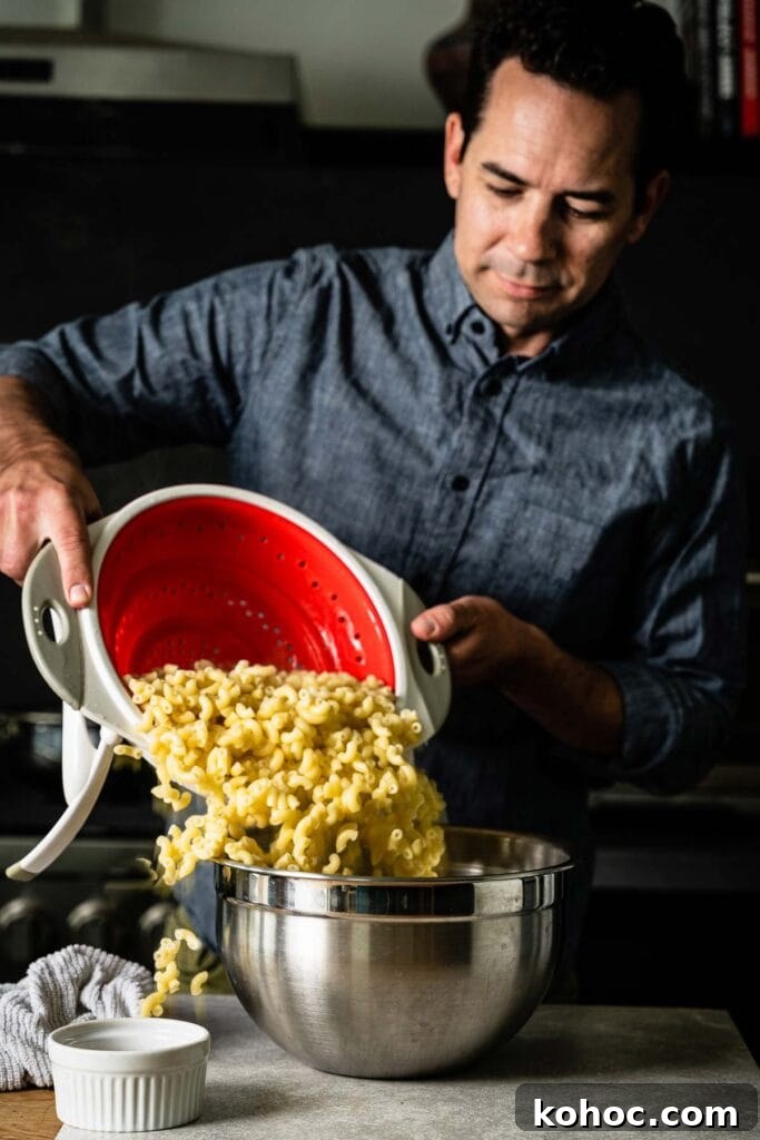 Classic Hawaiian Macaroni Salad Recipe for Tropical Gatherings 4 pouring macaroni into bowl