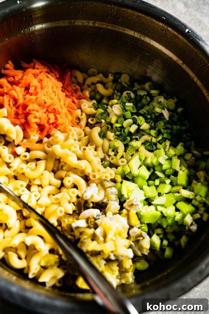 Classic Hawaiian Macaroni Salad Recipe for Tropical Gatherings 6 macaroni salad ingredients in a bowl to mix