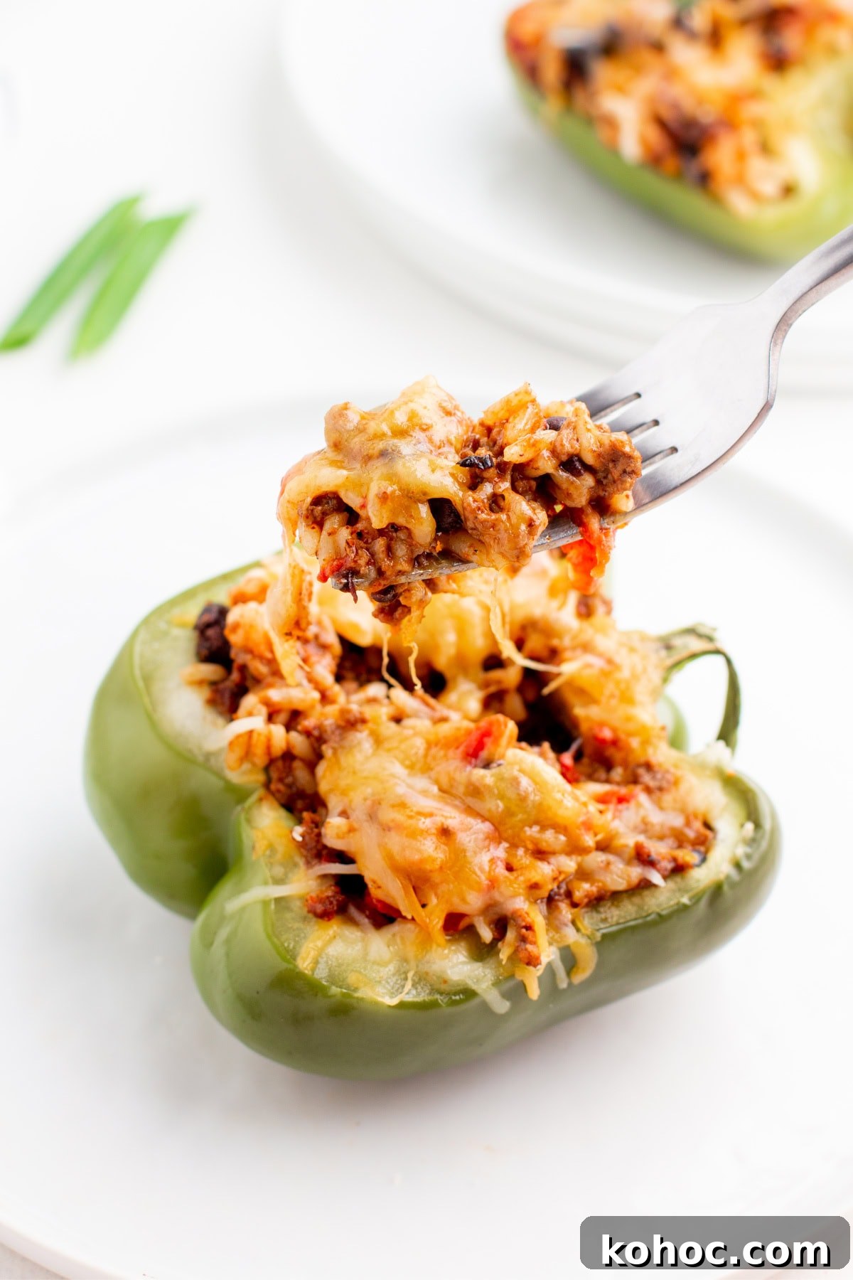 fork full of taco stuffed peppers