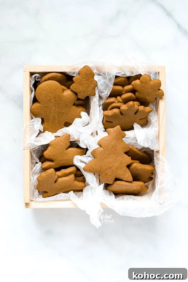 Gluten-Free Gingerbread Cookies Recipe for Perfect Holiday Bakes 4 Gluten Free Gingerbread Cookies in a square wood cookie box
