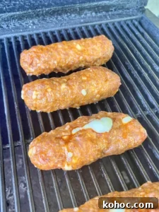 Queso-Stuffed Sausage Breakfast Dogs with Melty Cheese 2 breakfast dogs on the grill