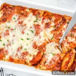 One-Pot Creamy Tomato Basil Pasta for Quick Weeknight Meals 9 close up overhead shot of Stuffed Shells garnished with parsley in a baking dish