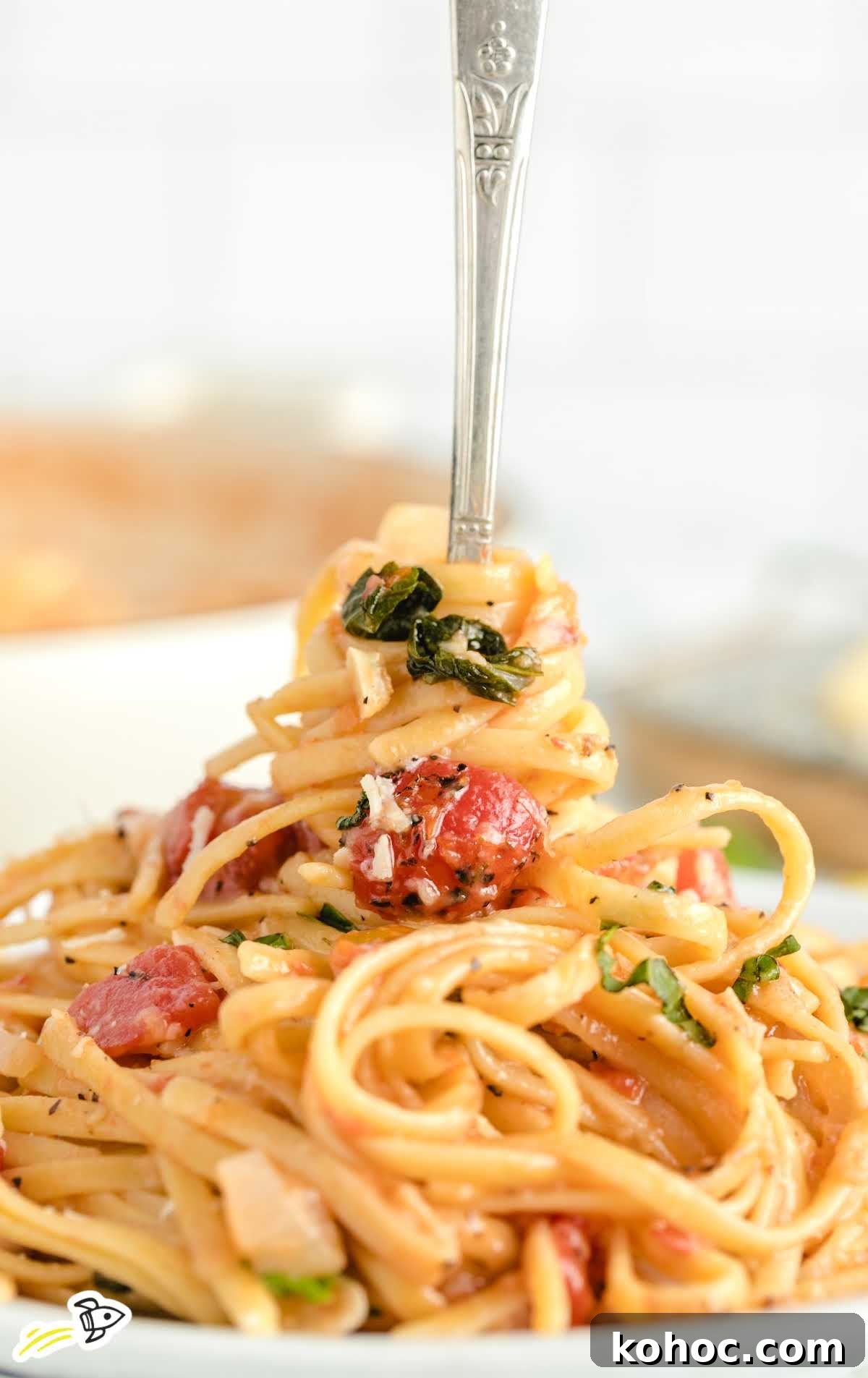 One-Pot Creamy Tomato Basil Pasta for Quick Weeknight Meals 10 close up shot of One Pot Pasta on a plate with a fork