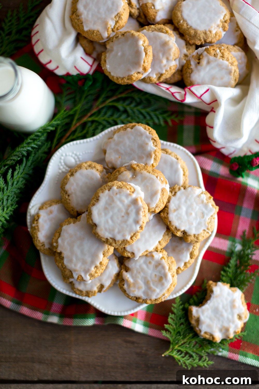 Chinese Five-Spice Iced Oatmeal Cookies Recipe 12 Plate of Chinese Five Spice Iced Oatmeal Cookies next to a bottle of milk with holiday decor - overhead angle