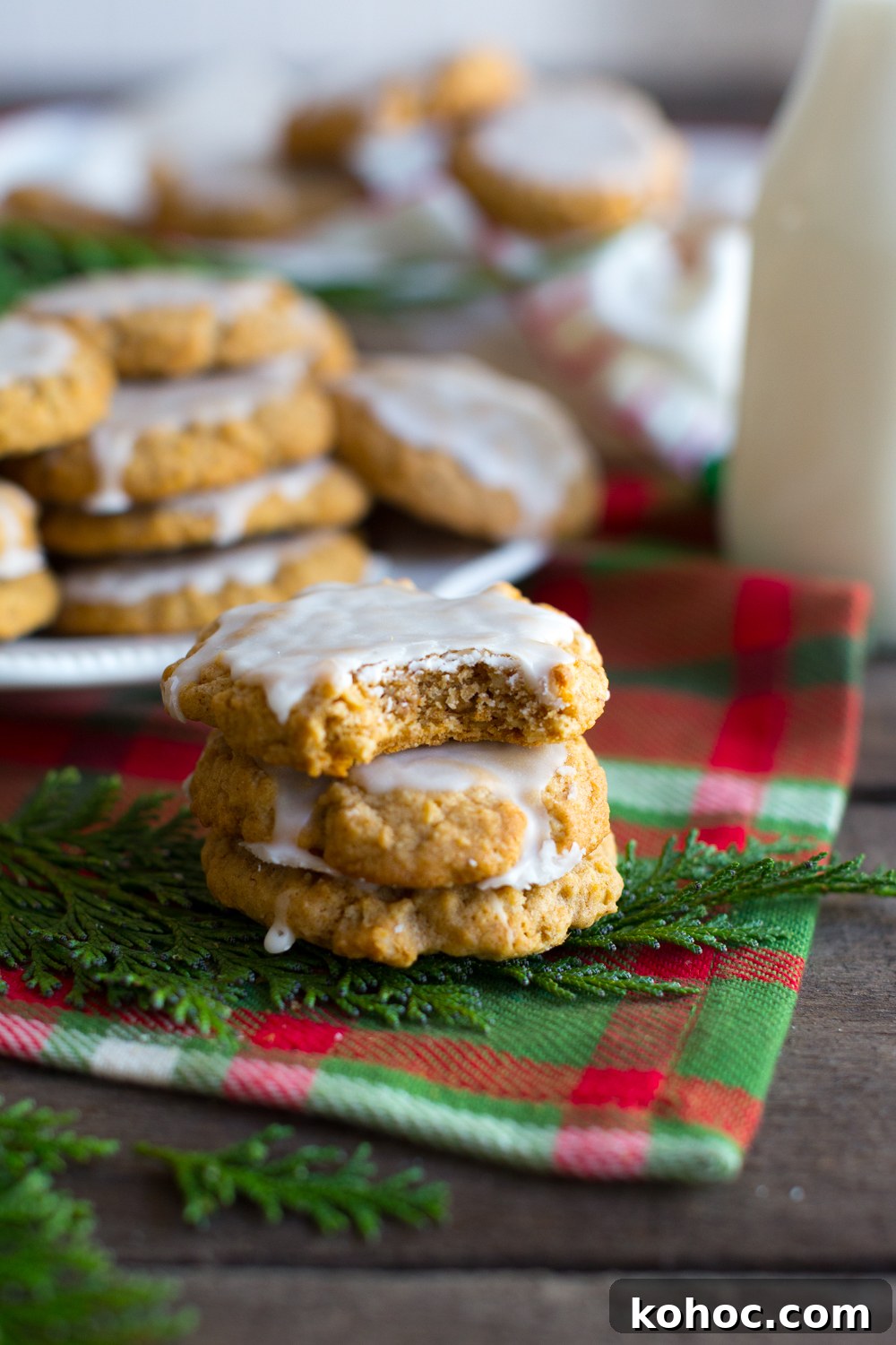 Chinese Five-Spice Iced Oatmeal Cookies Recipe 13 Bite of Chinese Five Spice Iced Oatmeal Cookies shows the chewy texture - angle shot with holiday decor