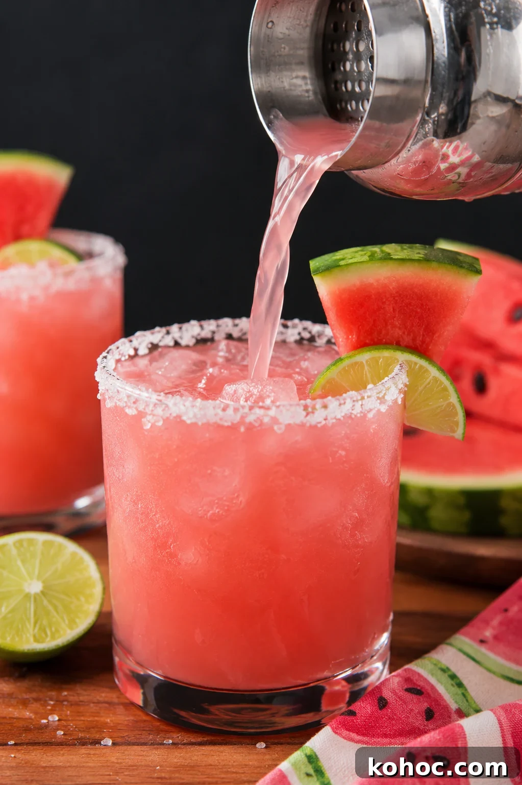 Refreshing Watermelon Margarita Recipe for Summer Cocktails 2 Watermelon Margarita ON A WOOD TABLE WITH A WATERMELON PRINTED NAPKIN TO THE SIDE