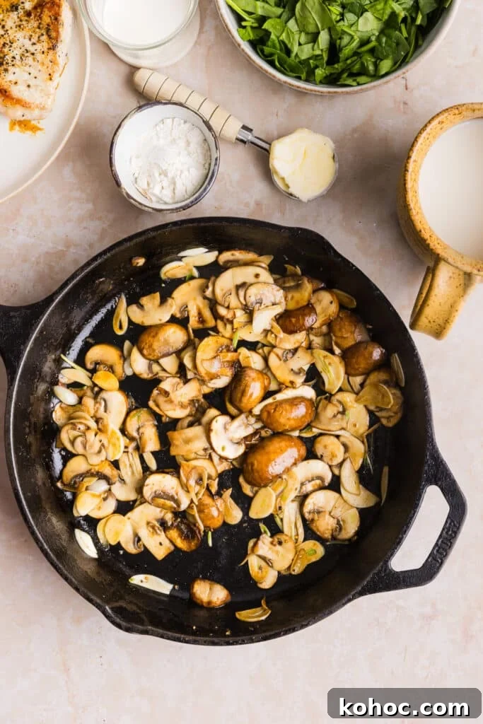 Creamy Garlic Pork Chops with Lighter Sauce 6 Mushrooms being sauteéd in a pan.