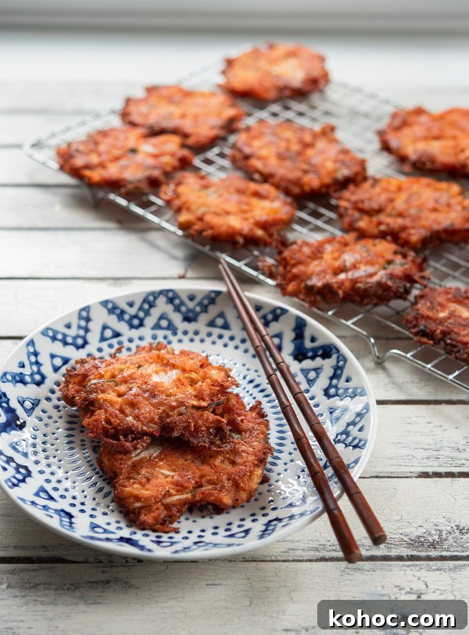 Cheesy Kimchi Potato Pancakes Recipe for Crispy, Flavorful Korean-Style Pancakes 3 Cheesy Kimchi Potato Pancakes on a serving dish.