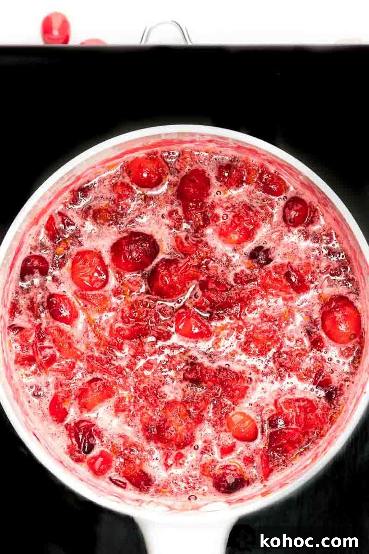 Overhead view of cranberry sauce being formed