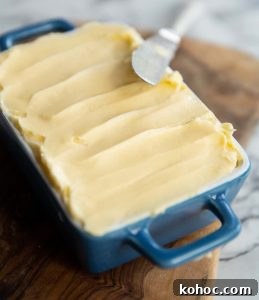 butter in a small blue dish with knife resting on it