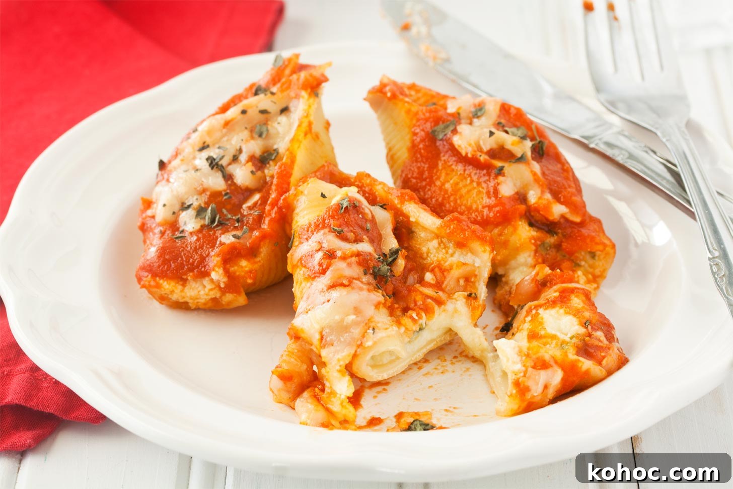 Cheese-Stuffed Pasta Shells Baked with Marinara and Mozzarella 3 Eating stuffed cheese shells with ricotta