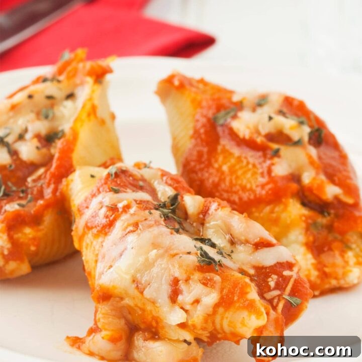 Close up of cheese stuffed shells with ricotta cheese, mozzarella, and Parmesan