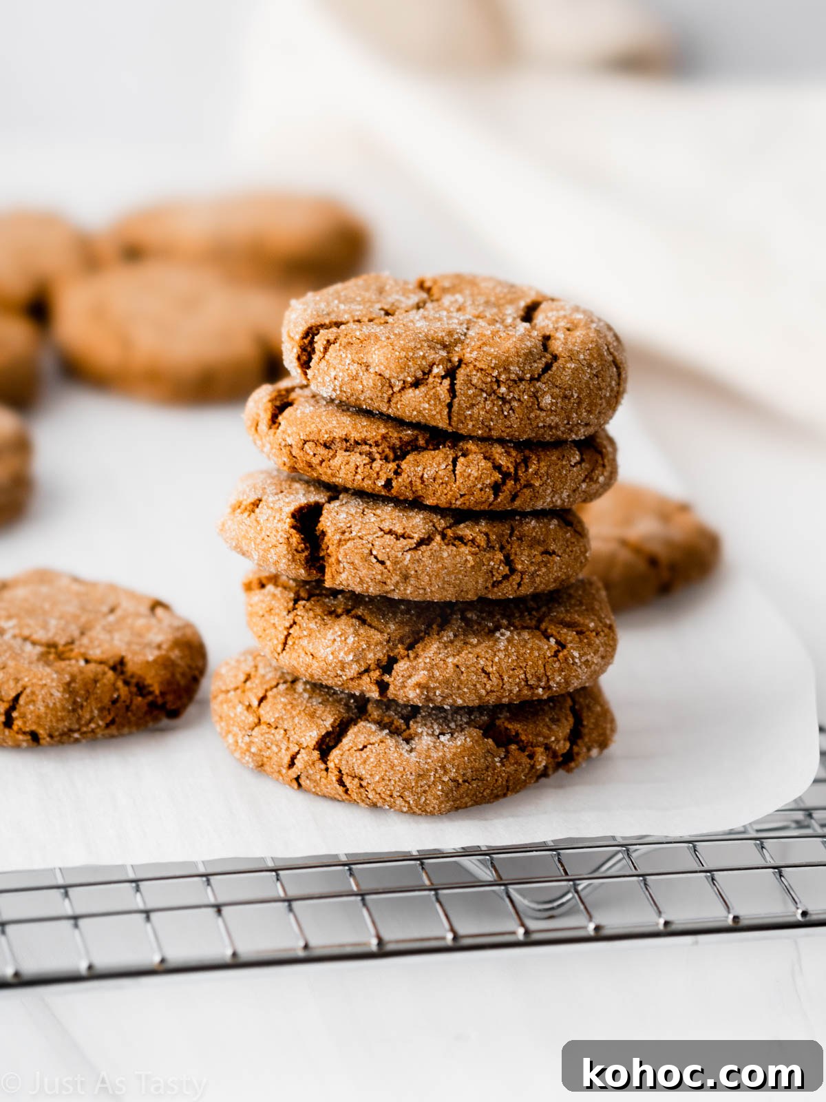 Crispy Gluten-Free Gingersnap Cookies You’ll Love 2 Stack of gluten free gingersnaps on a cooling rack.
