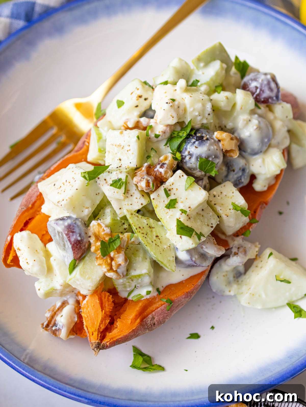 Waldorf Salad with Greek Yogurt Dressing — Light Apple & Walnut Salad 4 Waldorf salad with apples celery grapes and toasted walnuts served on a baked sweet potato.