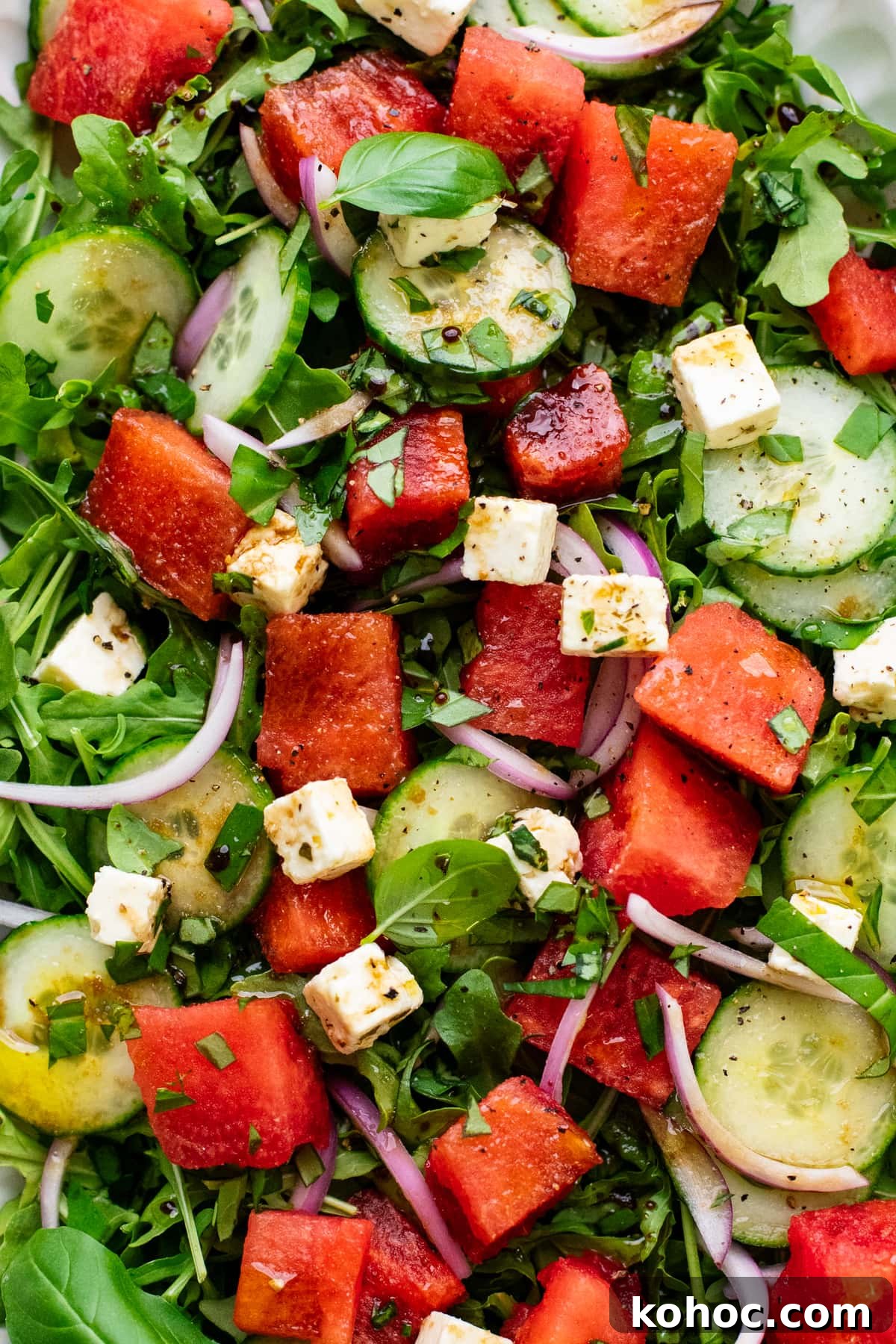 Watermelon, Feta & Basil Salad with Balsamic Glaze 6 watermelon salad with feta and leafy greens.