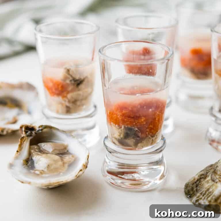 A photo of the oyster shooters with raw oysters in their half shell.