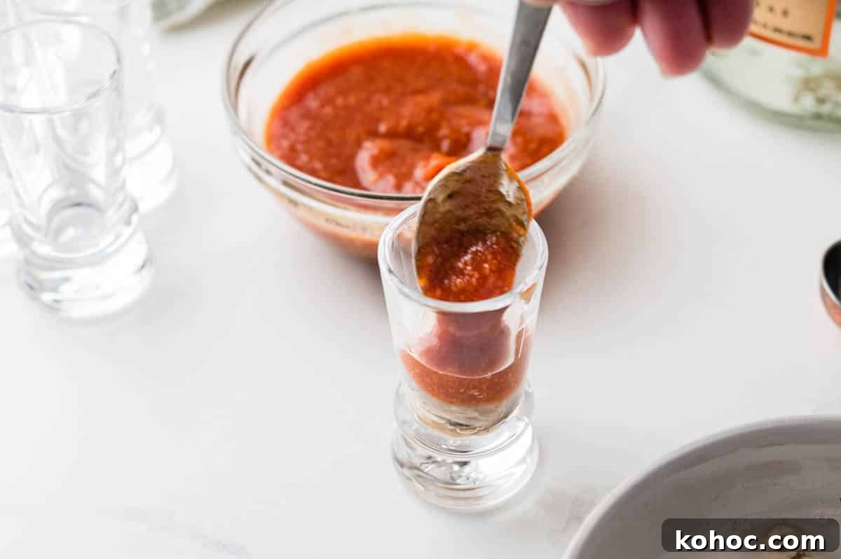 Adding cockail sauce.