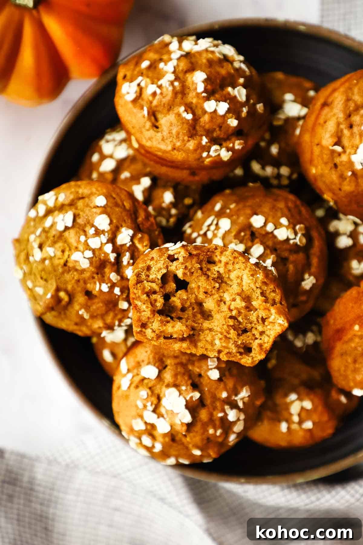 Moist Pumpkin Oatmeal Muffins with Warm Spices 2 a dish filled with pumpkin oatmeal muffins