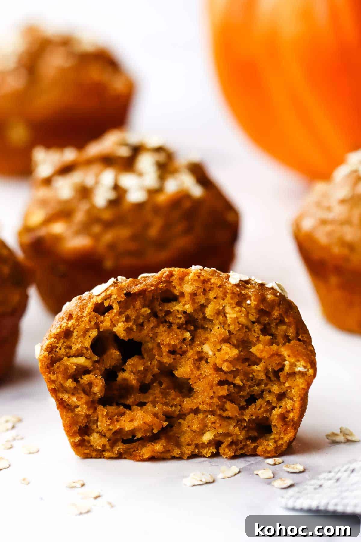 Moist Pumpkin Oatmeal Muffins with Warm Spices 9 A pumpkin muffin halved to show the inside texture.