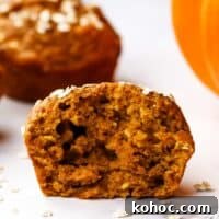 Moist Pumpkin Oatmeal Muffins with Warm Spices 10 Closeup of the inside of a muffin split in half.