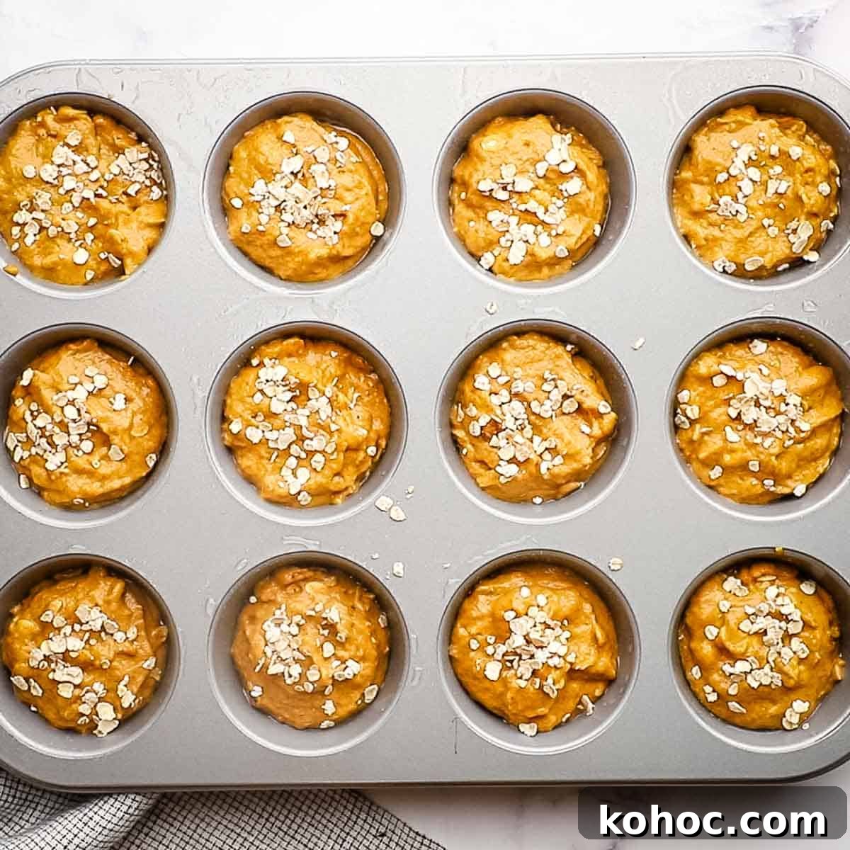 Moist Pumpkin Oatmeal Muffins with Warm Spices 7 oatmeal muffin batter in a muffin tin