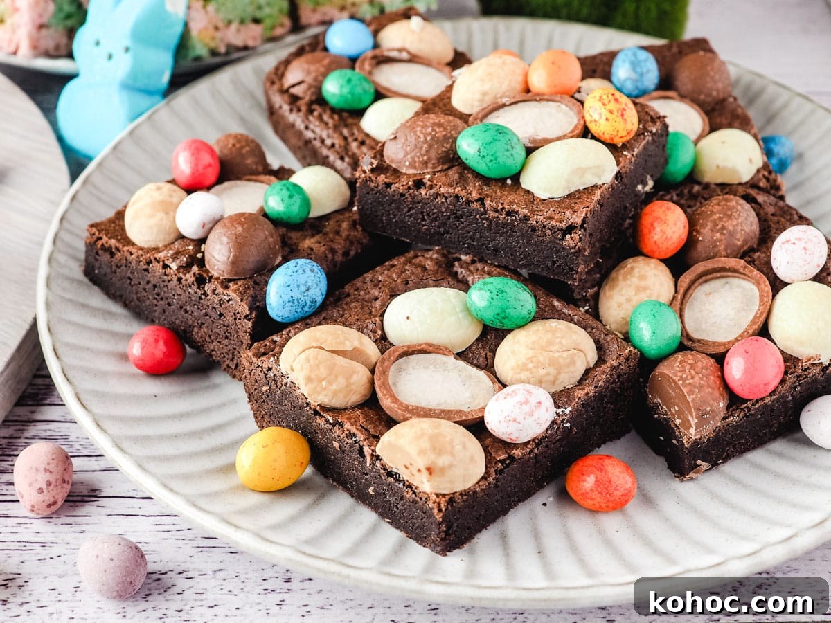 Easter brownie on a plate with extra Easter eggs.