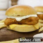 A homemade Filet-O-Fish sandwich on a cutting board.