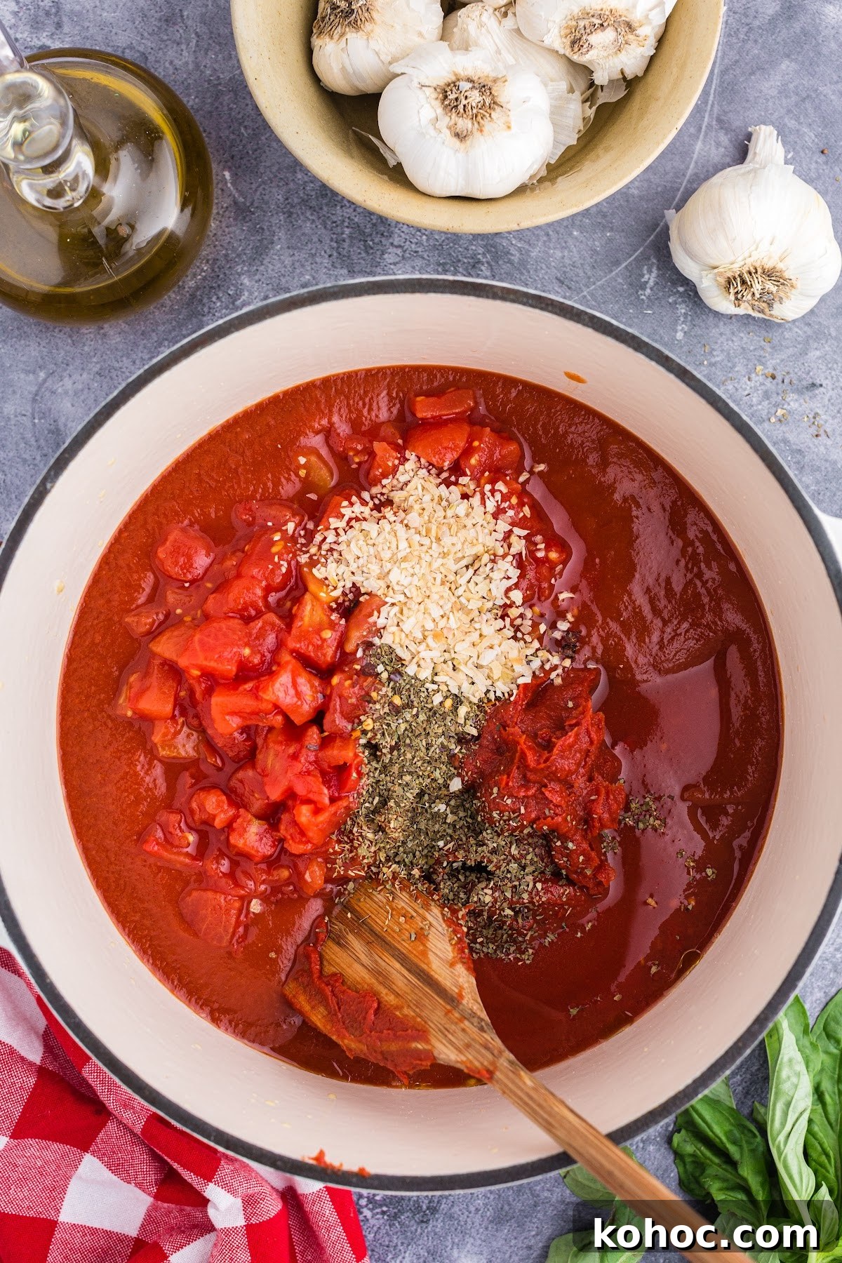 Zesty Spicy Marinara Sauce Recipe for Bold Tomato Flavor 5 All herbs and tomatoes being added to the pot.