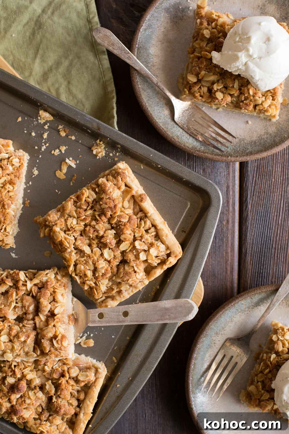 A top down view of a Dutch Apple Slab Pie with a few pieces cut out. 
