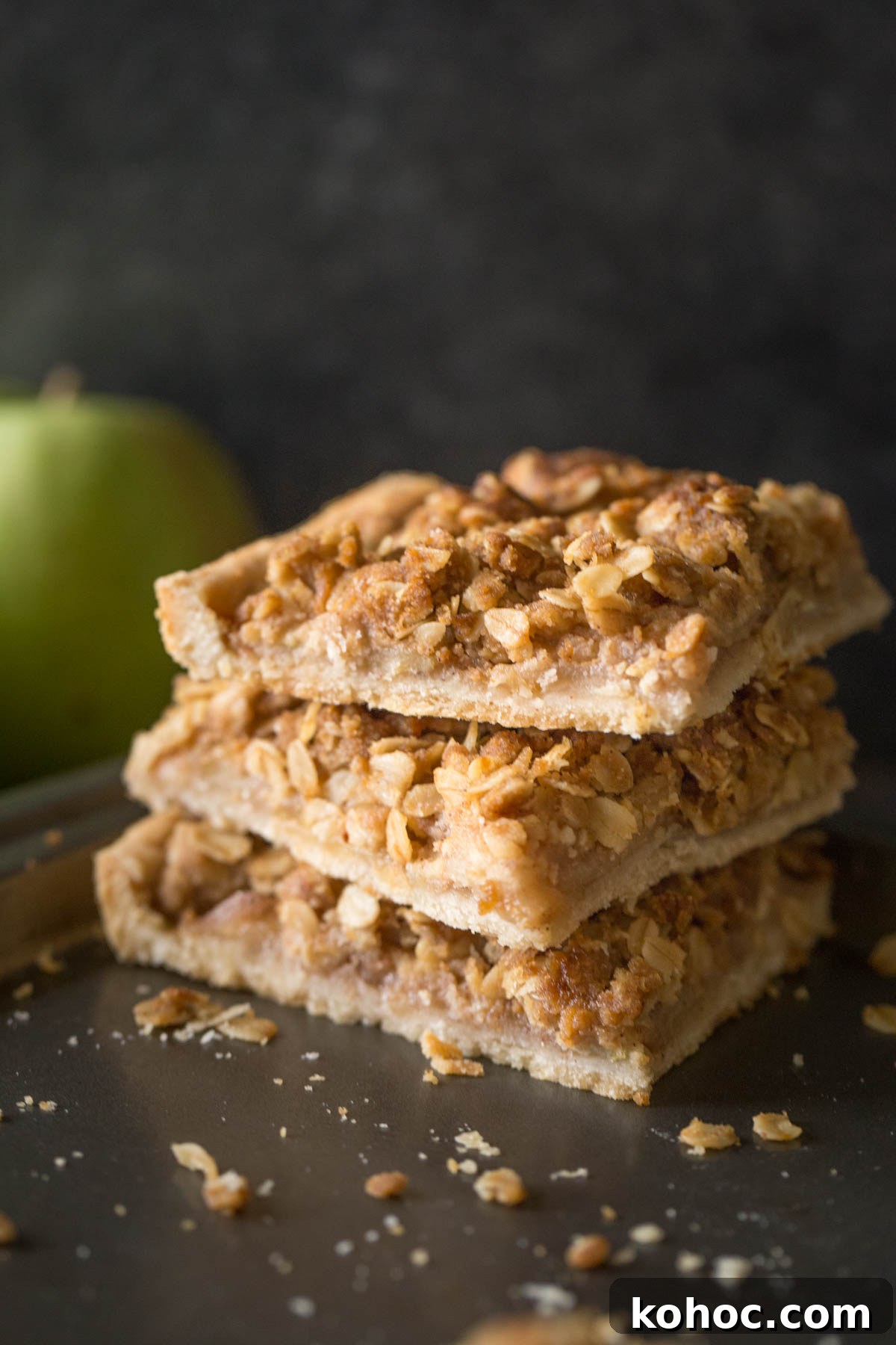 A stack of three squares of Dutch Apple Slab Pie on a baking sheet. 
