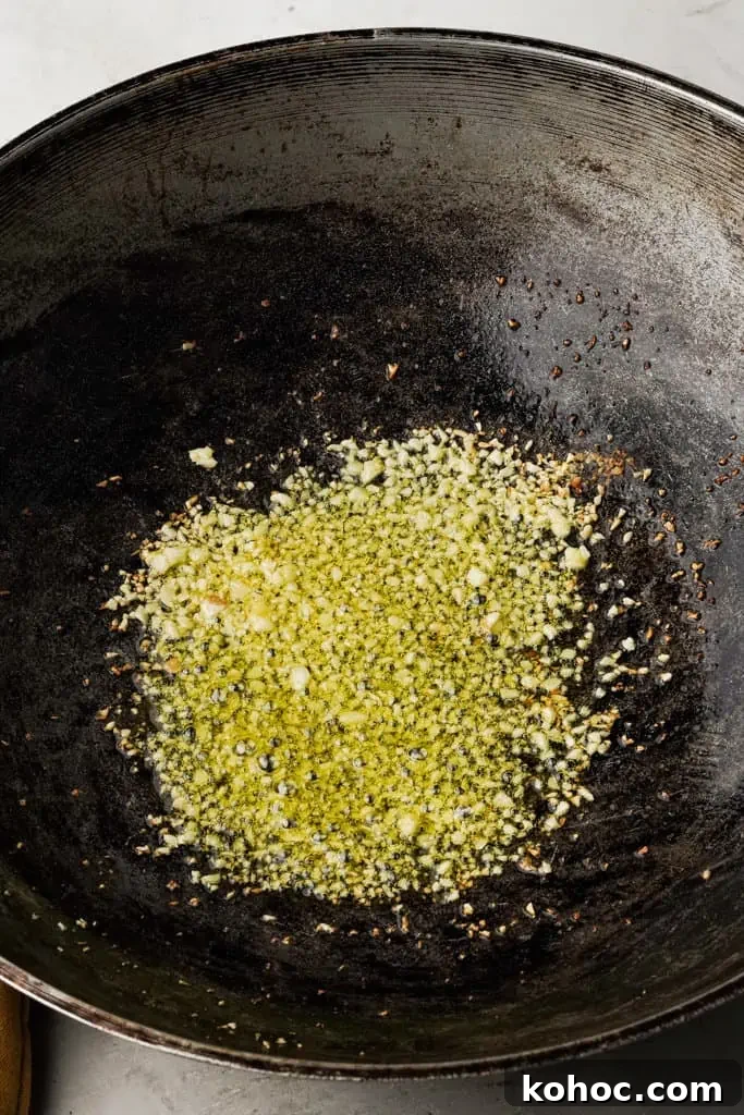 garlic and ghee in a skillet for sinangag