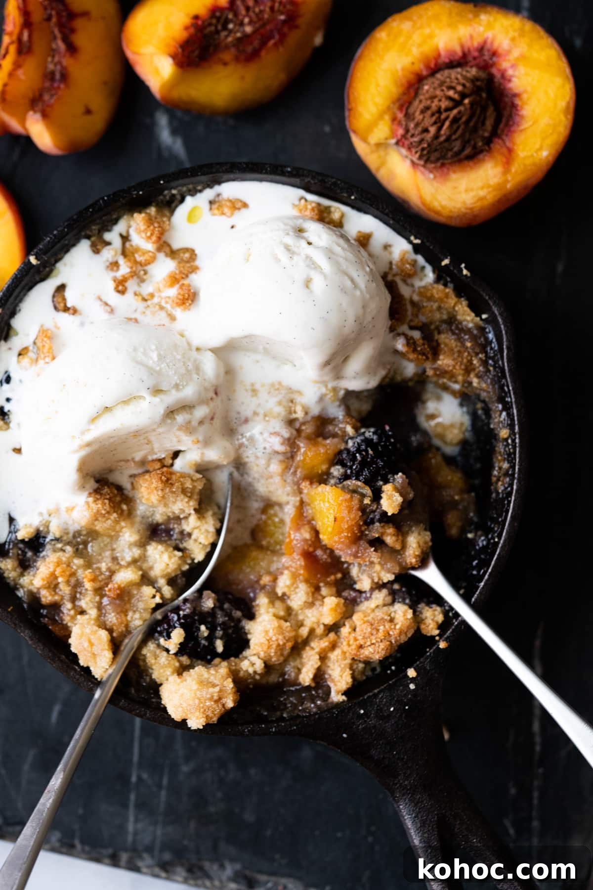Keto Almond Flour Peach and Blackberry Crisp Recipe 2 Keto peach and blackberry crisp baked in a skillet and served with two scoops of vanilla ice cream