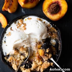 Keto Almond Flour Peach and Blackberry Crisp Recipe 5 Keto peach and blackberry crisp baked in a skillet and served with two scoops of vanilla ice cream