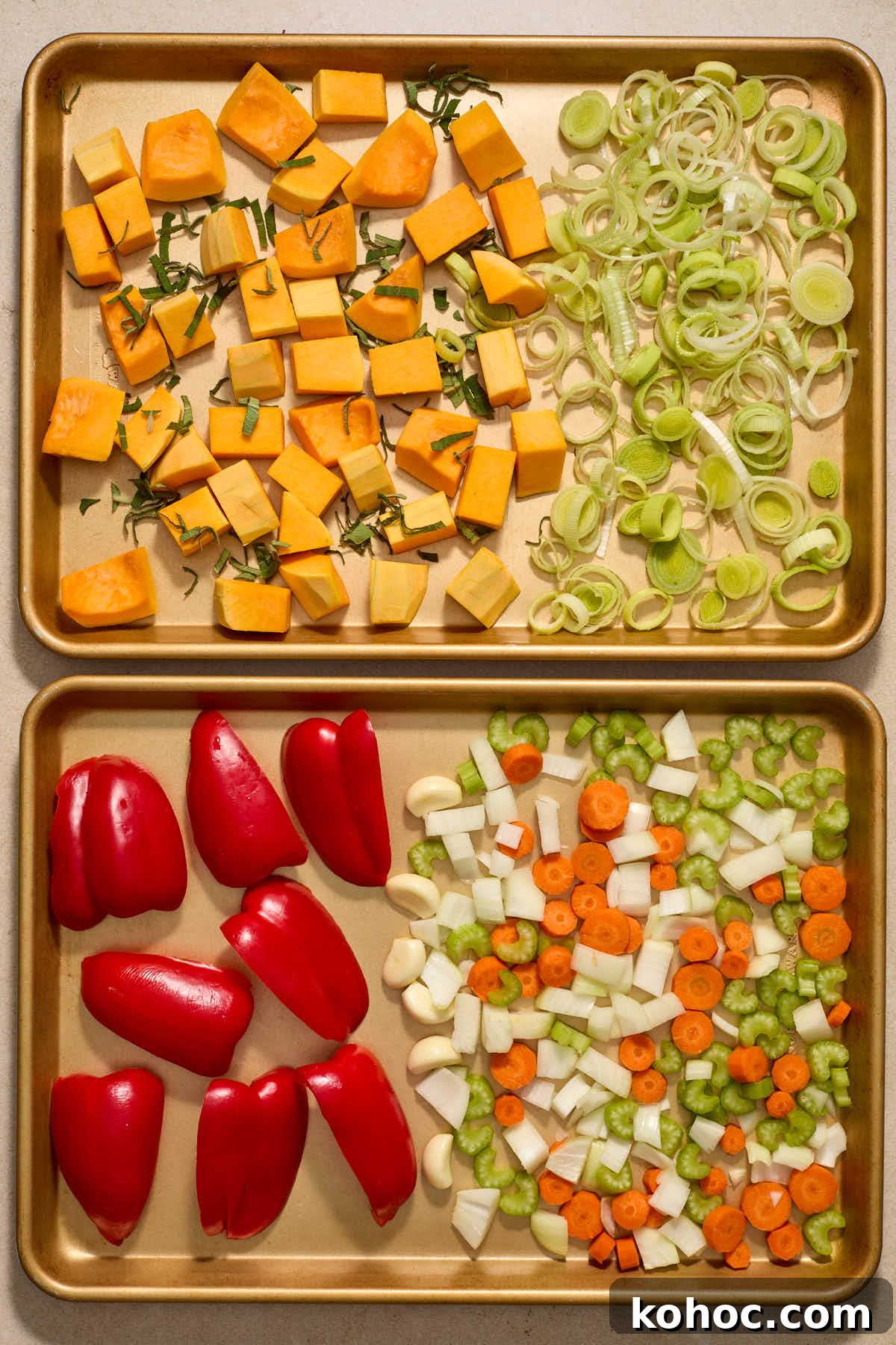 Roasted Red Pepper & Butternut Squash Soup — Dairy-Free Vegan Recipe 4 Chopped squash and vegetables arranged on two sheet pans.