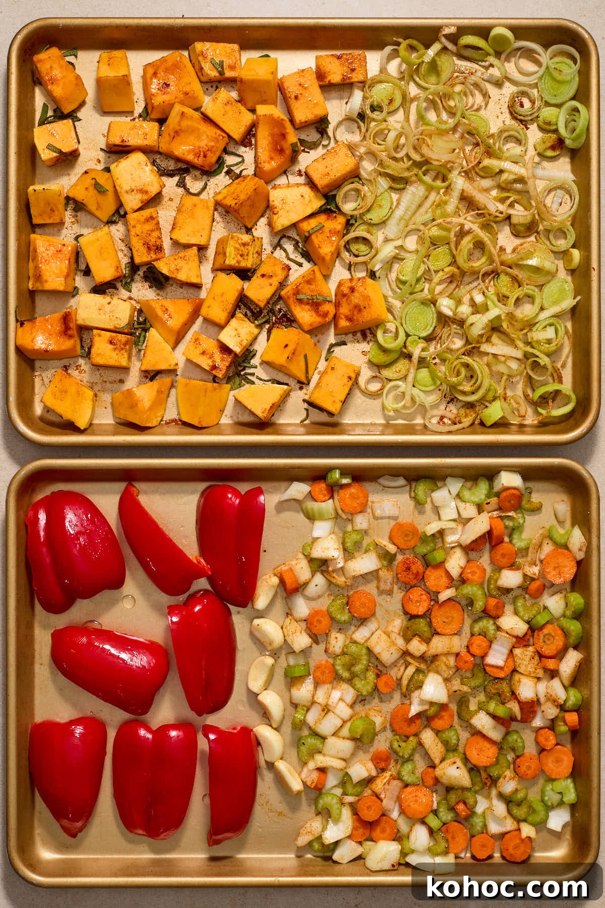 Roasted Red Pepper & Butternut Squash Soup — Dairy-Free Vegan Recipe 5 Squash and vegetables tossed with oil and seasonings on the sheet pans.