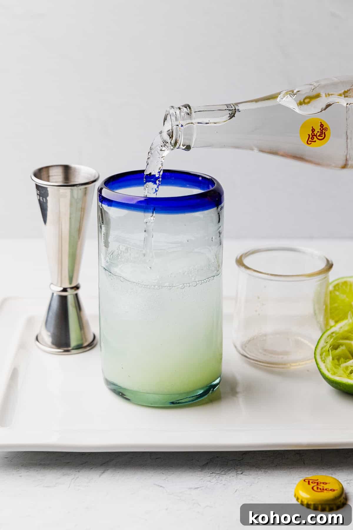 How to Make a Classic Texas Ranch Water Cocktail 7 Pour topo chico into glass.