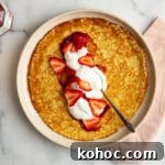 Gluten free crepe filled with strawberry jam, whipped cream and sliced strawberries.