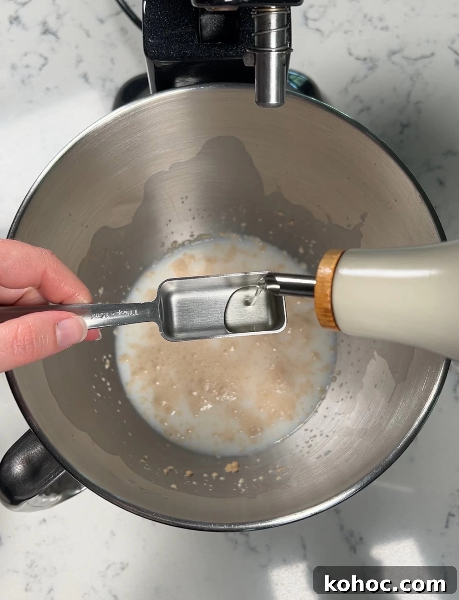 Whole Grain Loaf Recipe: Rustic Nordic Grovbrød Guide 14 Adding oil to the bread dough.