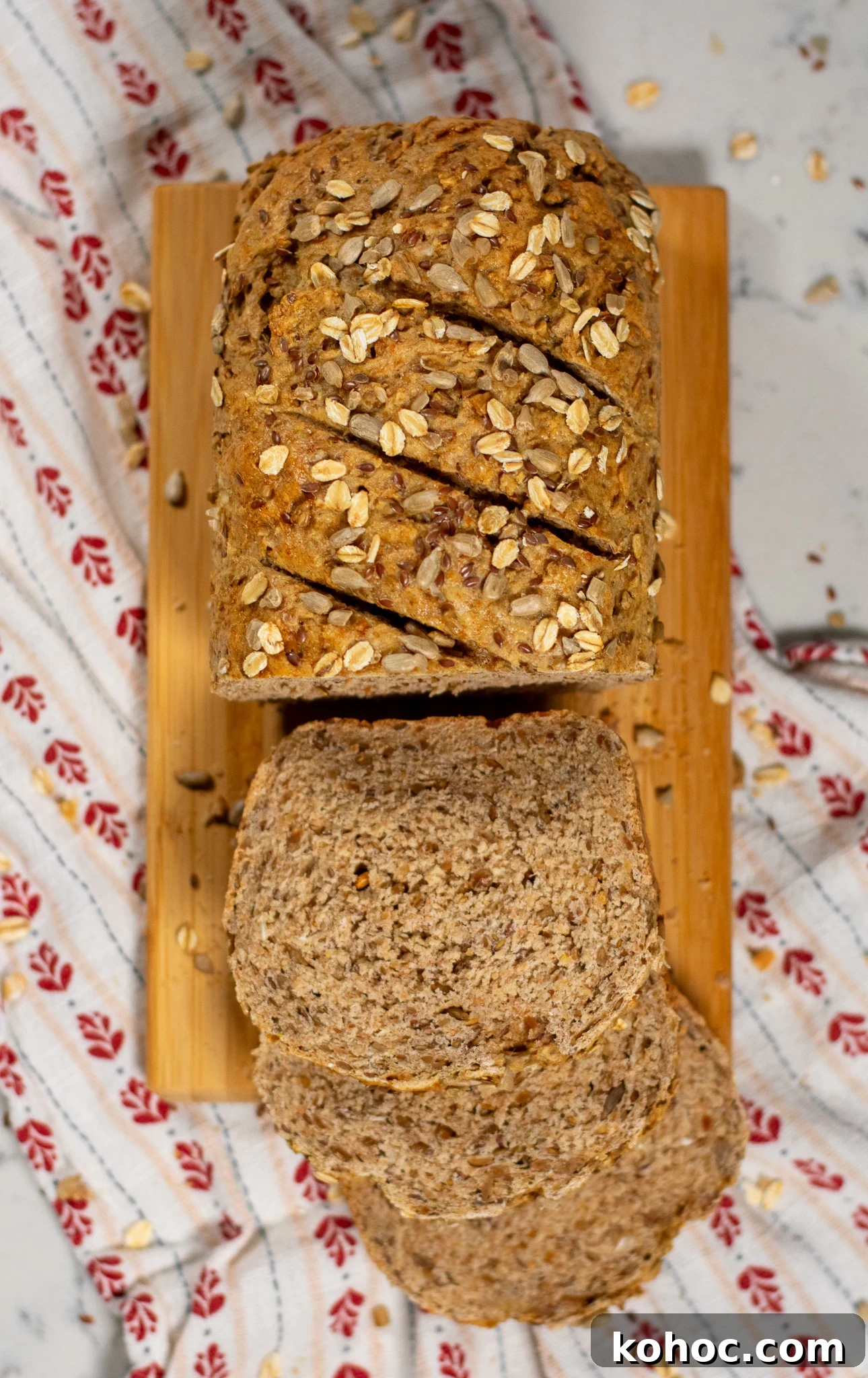 Whole Grain Loaf Recipe: Rustic Nordic Grovbrød Guide 3 Sliced loaf of whole grain bread on a cutting board.